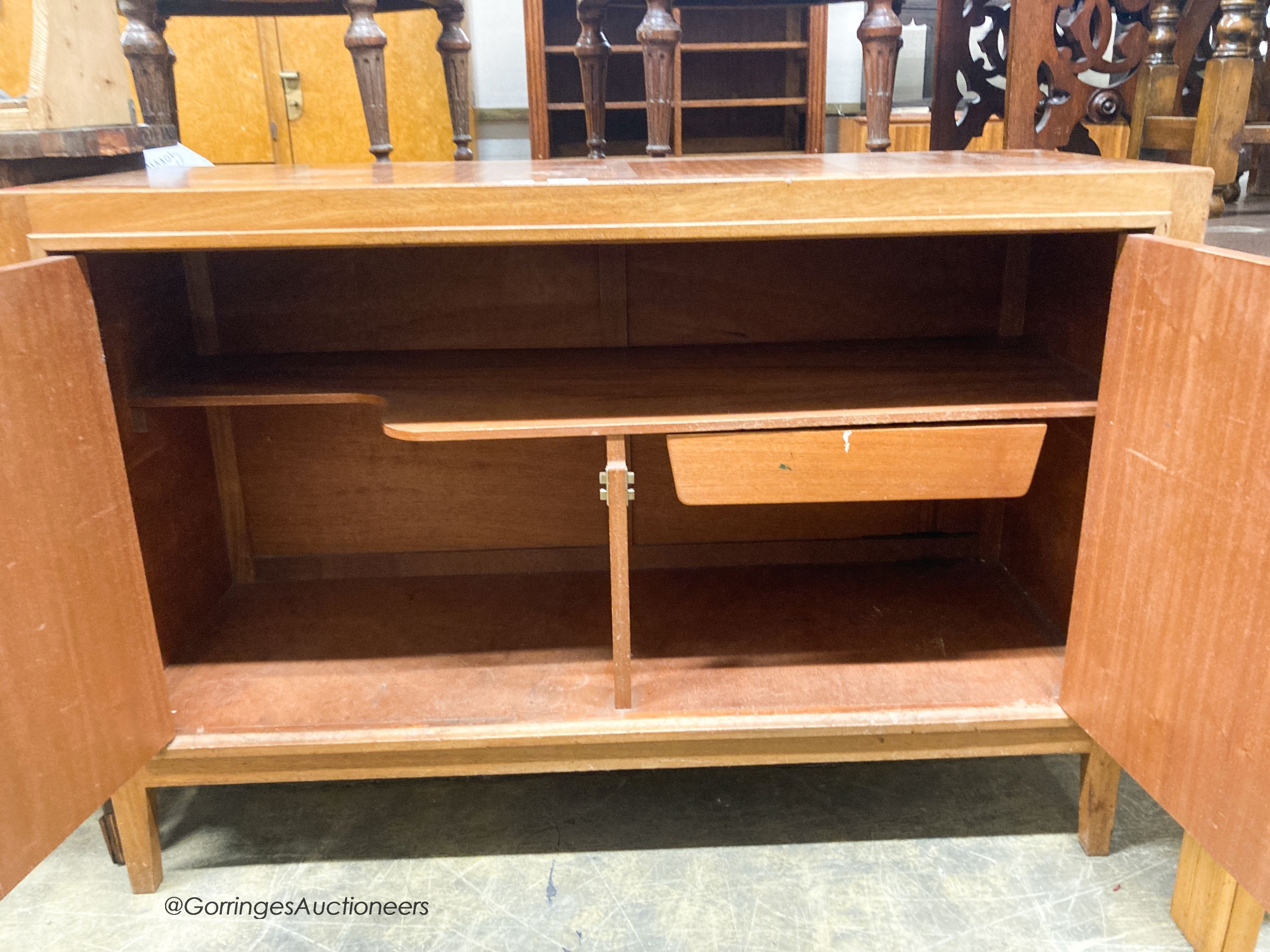 A Gordon Russell teak matrix side cabinet, W.122cm D.46cm H.84cm